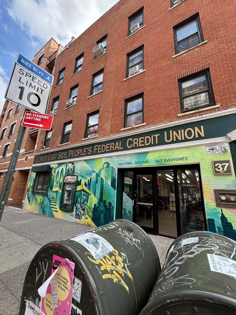 The Lower East Side People's Federal Credit Union on Avenue B, its mural of the neighborhood across the storefront.
