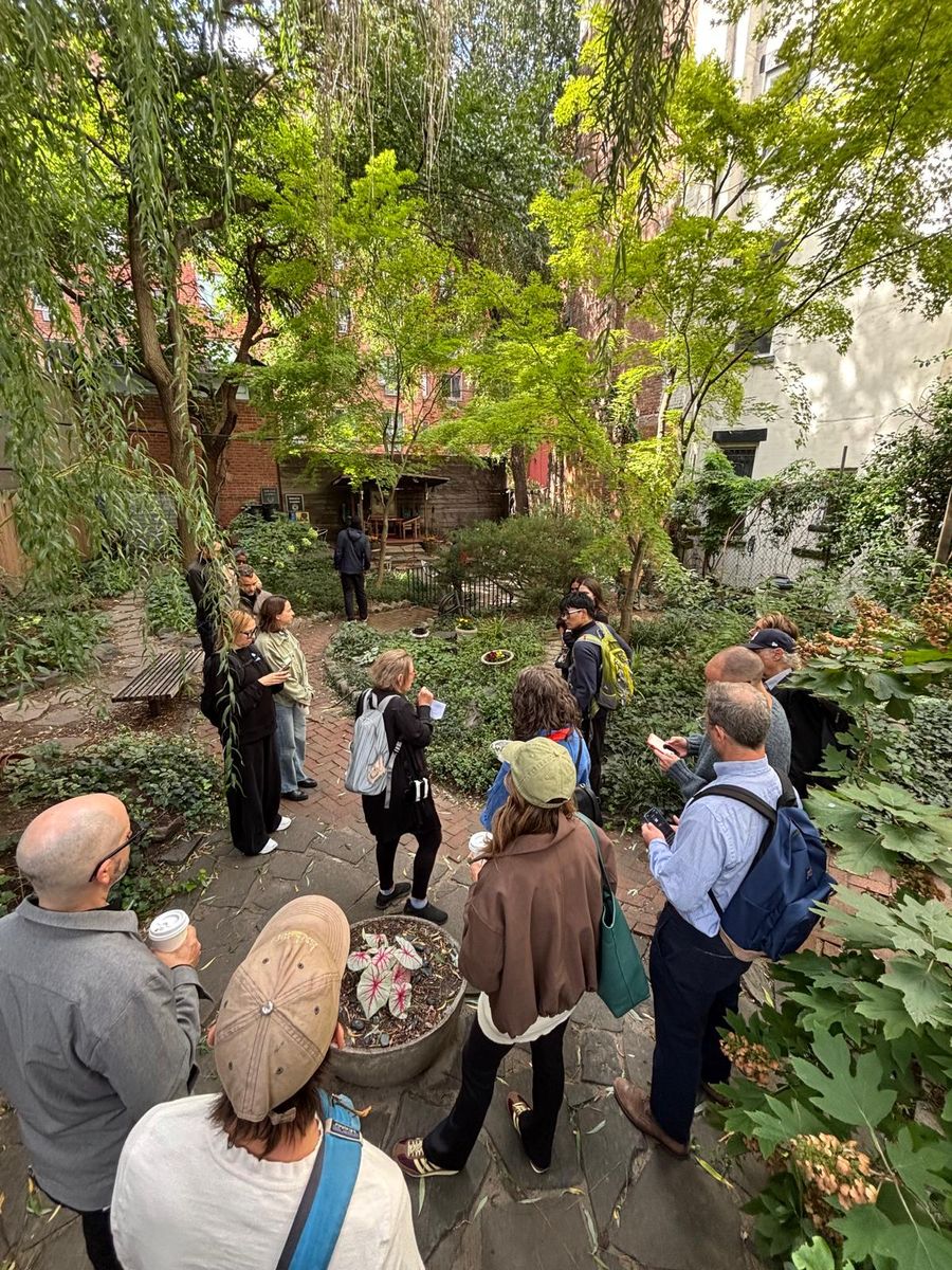 The group spread along the garden's winding path, seen from above.