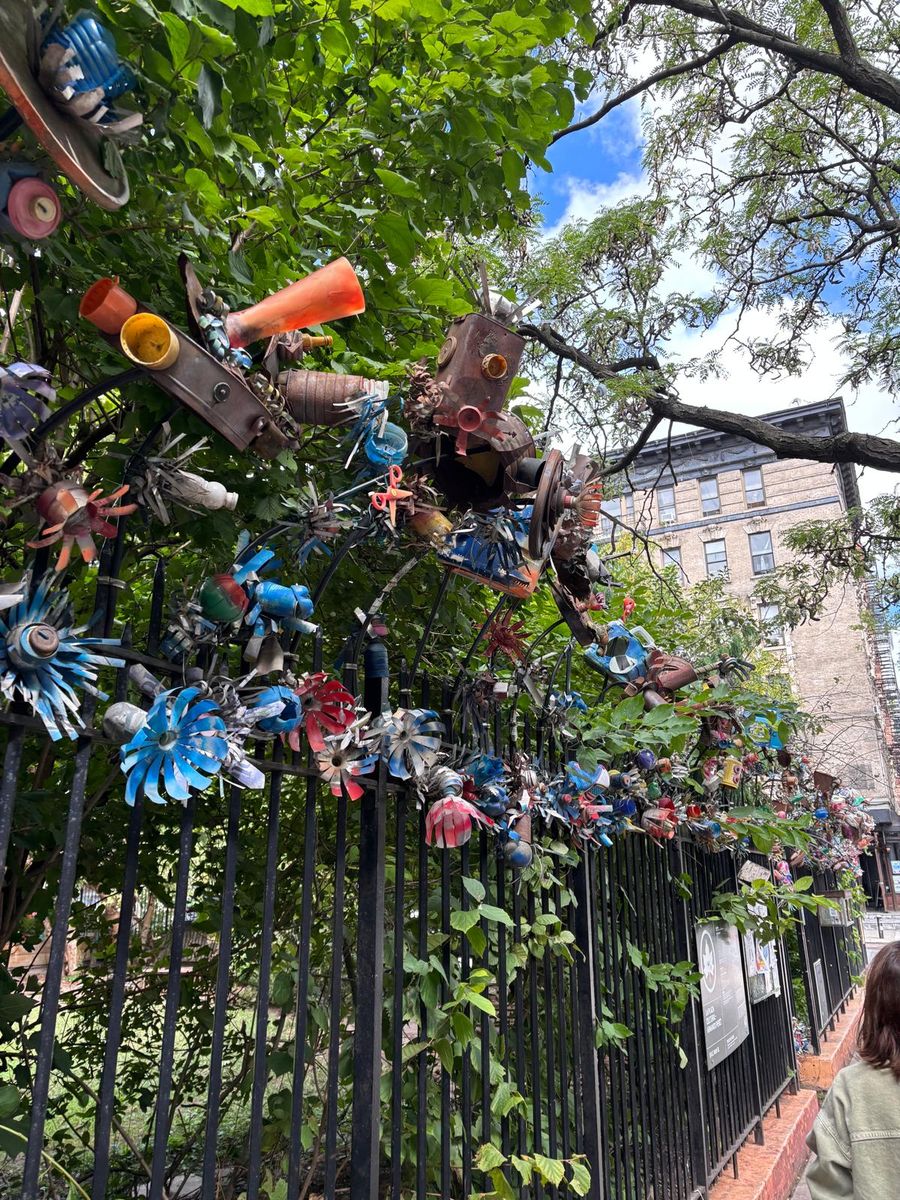 Rolando Politi's Winter Flowers, sculptures of found objects, along the fence of La Plaza Cultural.