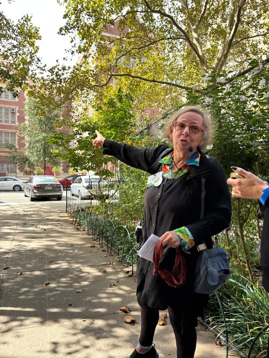 Wendy Brawer pointing across the Village View grounds toward the parking lot at the heart of the $30 million question.