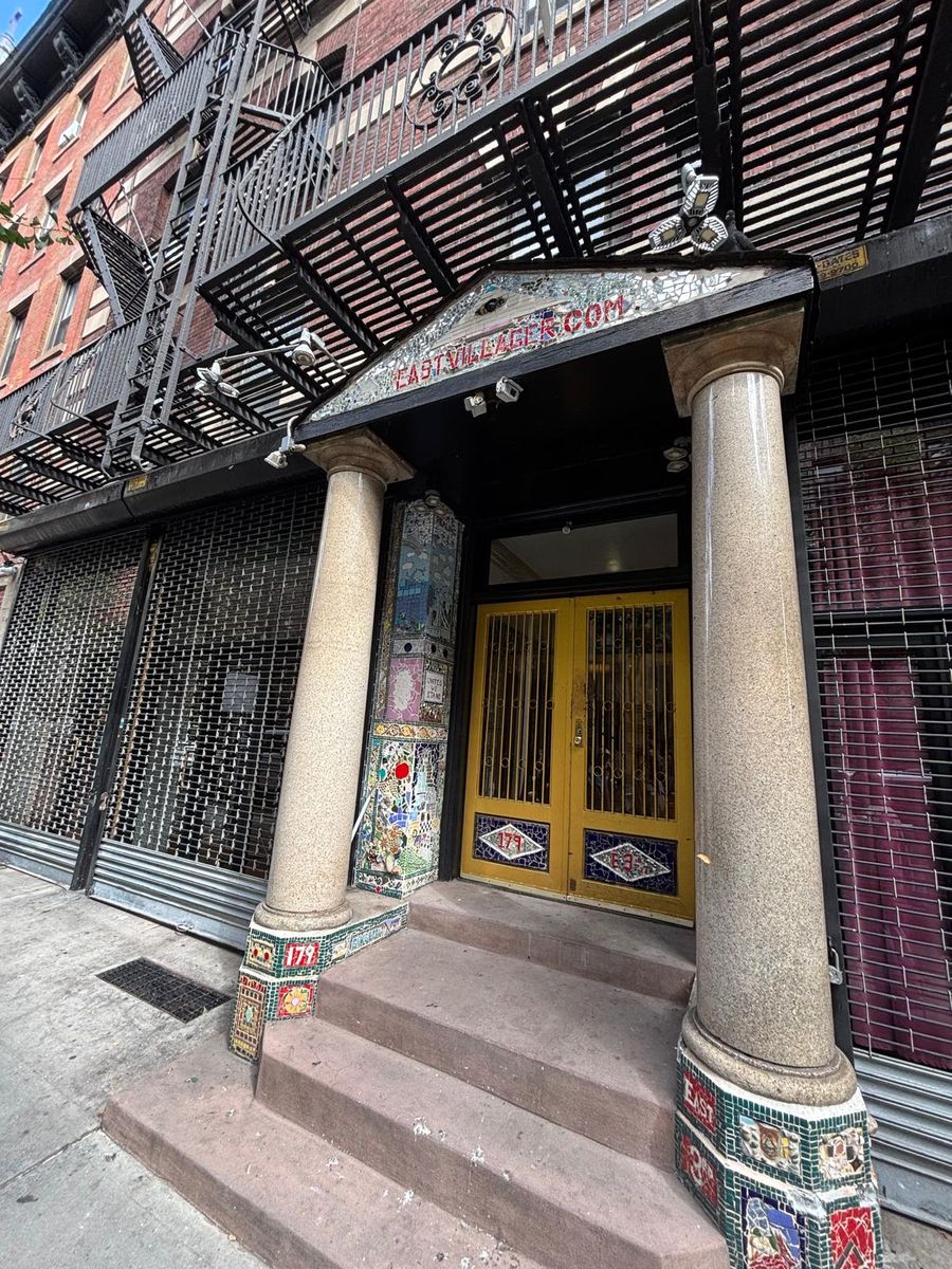 A mosaic-covered doorway on East 3rd Street, the columns tiled by Jim Power.
