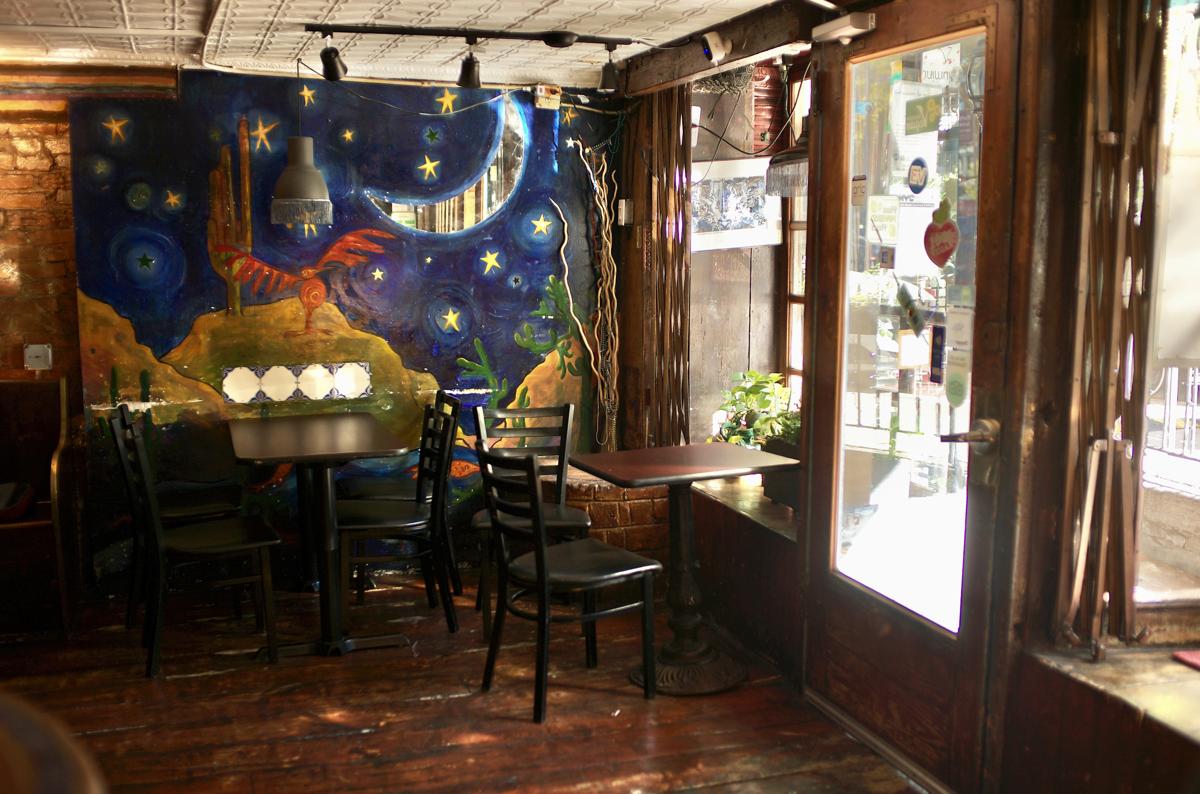 The night-sky mural beside the front window