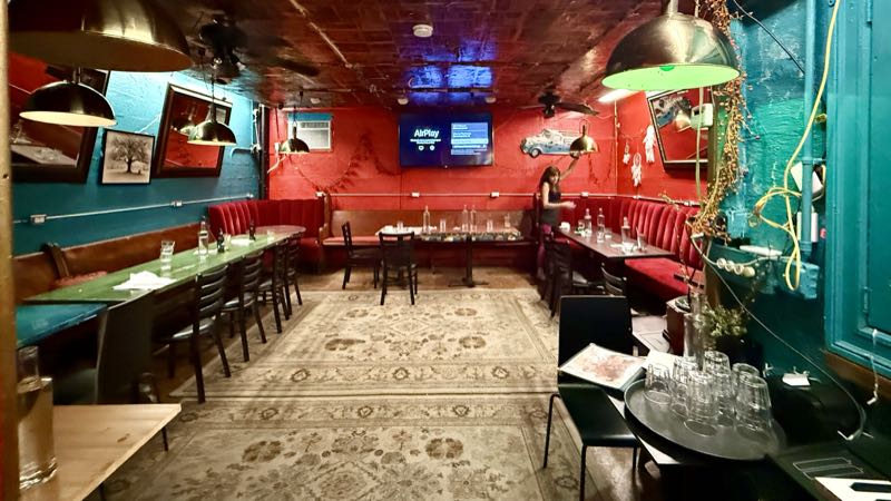The Dream Room, teal and red, set for a working dinner
