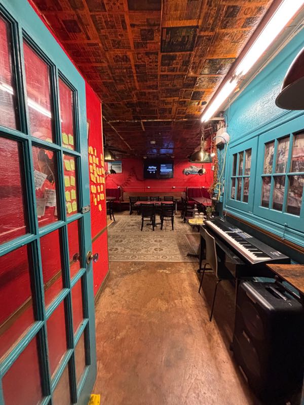 French doors into the Dream Room, piano at the ready