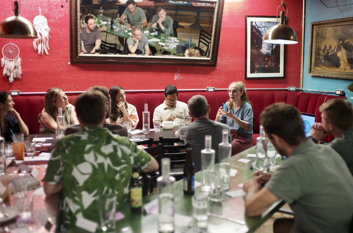 A dinner conversation filling the length of the Dream Room