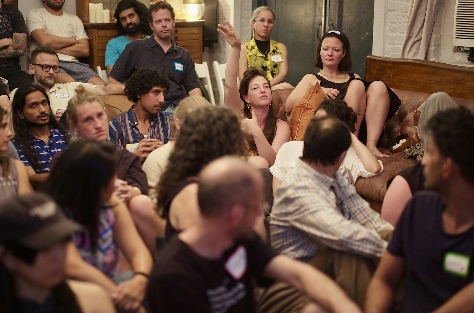 A hand going up at the back of the room while the discussion was still running.